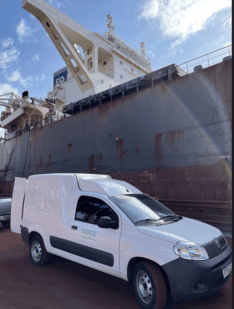 Tropical Ship Supply delivery van alongside a vessel hull at the berth