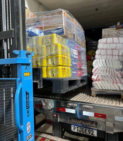 Provisions on a pallet lift being loaded for delivery to the vessel