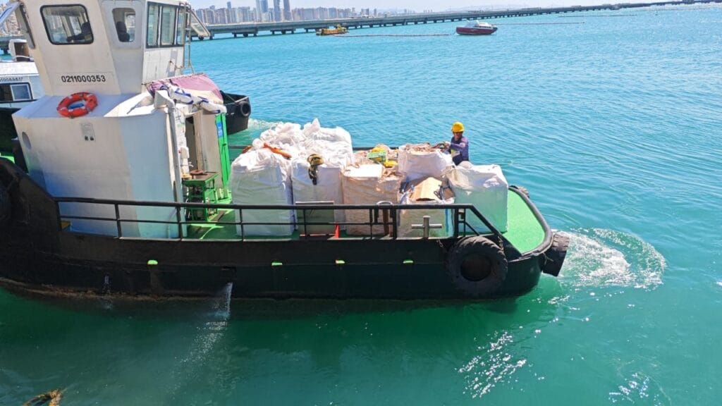 Supply boat carrying provisions to a vessel at the anchorage in Brazil