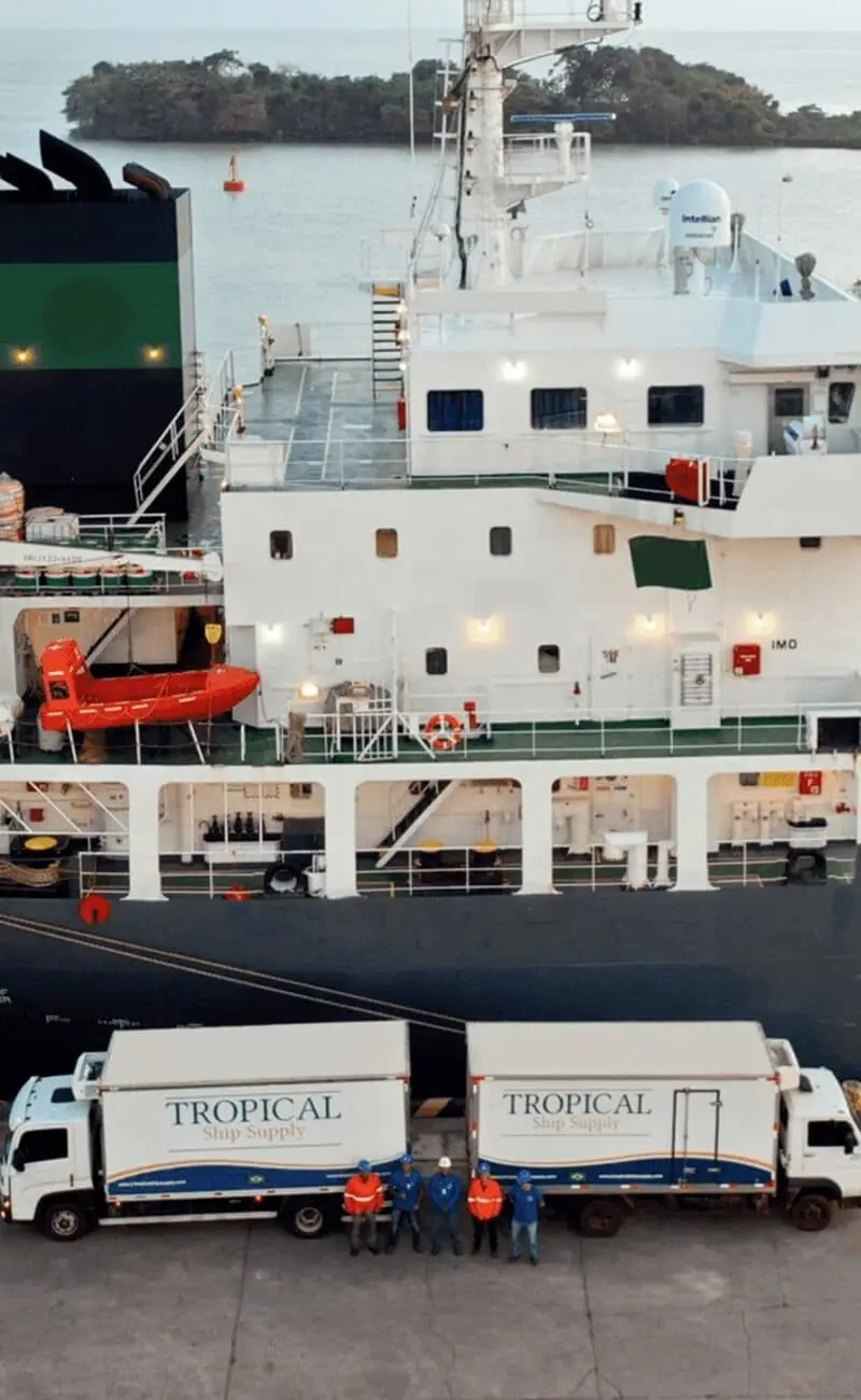 Tropical Ship Supply refrigerated trucks and crew alongside a vessel in a Brazilian port